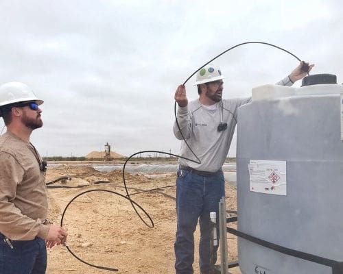 chemical automation installer performing a tank level monitor installation