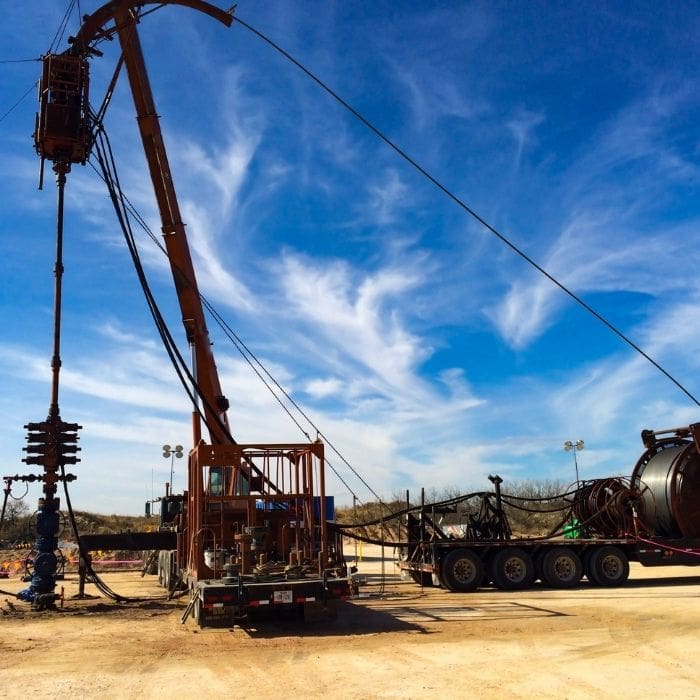 workover rig installing coiled tubing